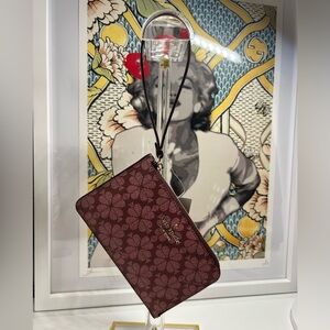 kate spade Floral Print Wristlet in Burgundy